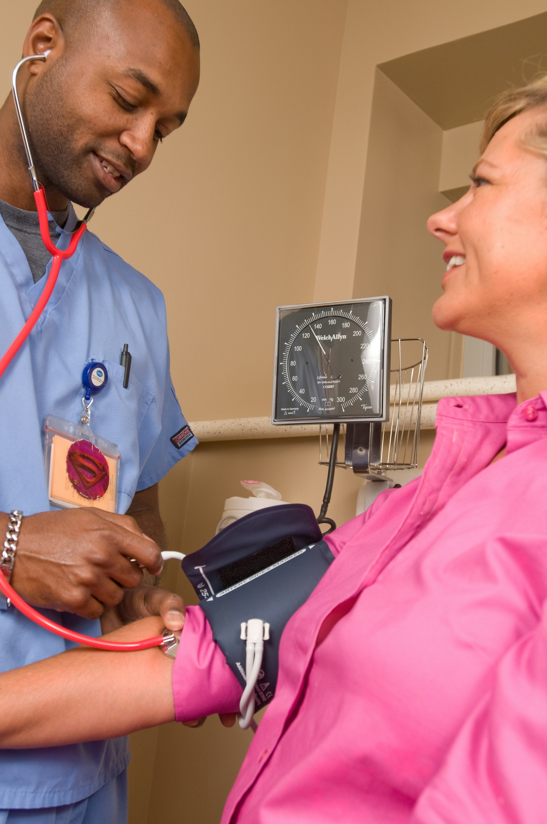 Nurse assisting patient at home